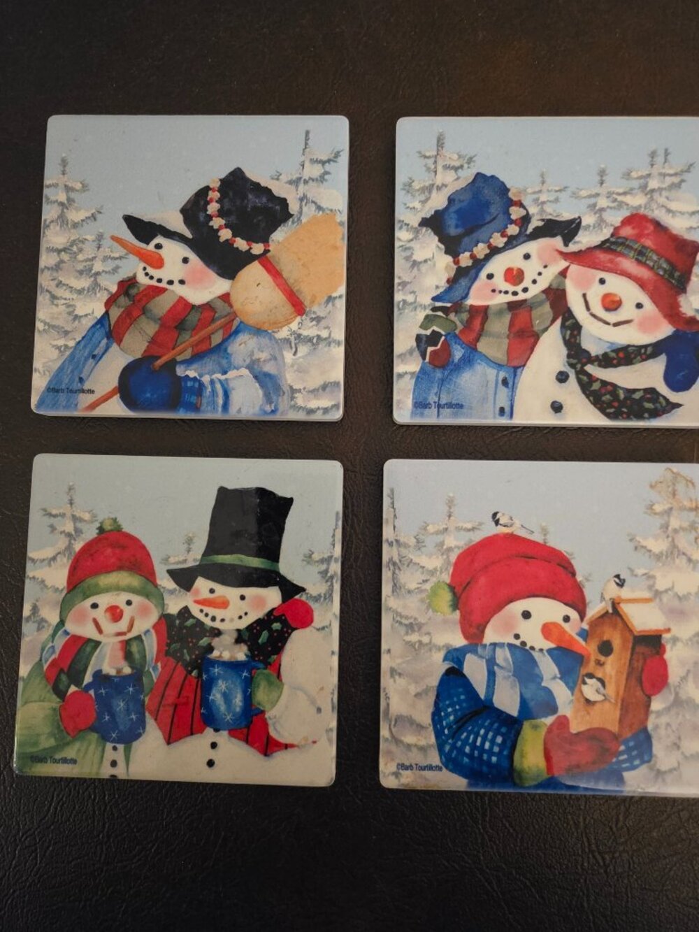 The Snowman Xmas Square Coasters are a set of 4 ceramic coasters